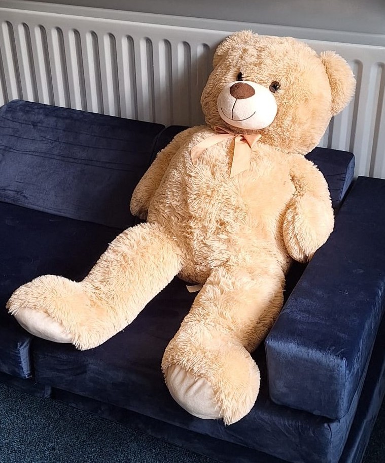 bear stuffed toy on a couch